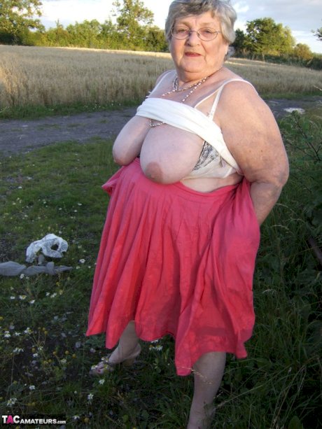 Obese oma Grandma Libby exposes her huge ass while in a field by a rural road