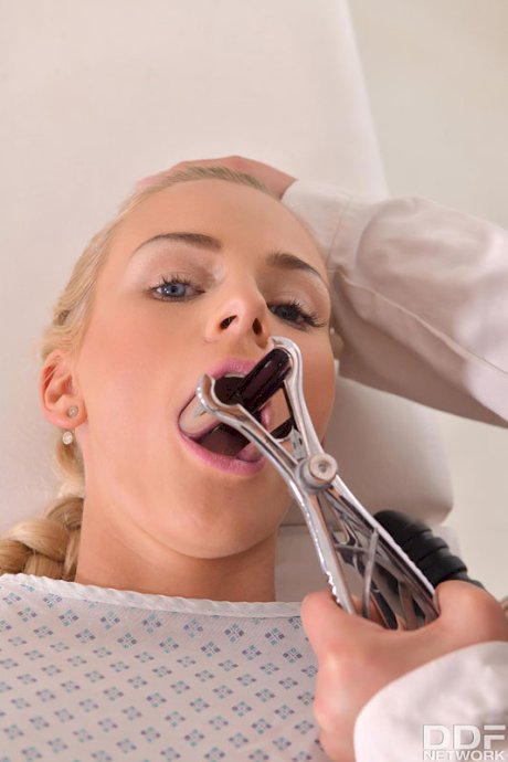Blonde girl undergoes an anal exam and strapon fucking from a lesbian doctor