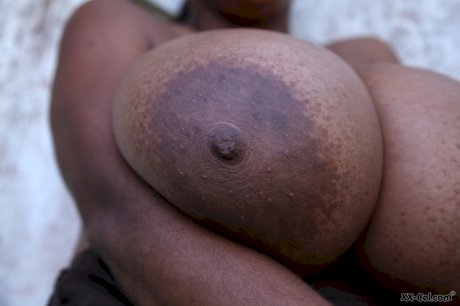 Puerto Rican woman Kristina Milan displaying her very big tits outdoors