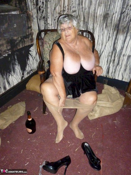 Old woman Grandma Libby sticks an empty bottle of booze in her vagina