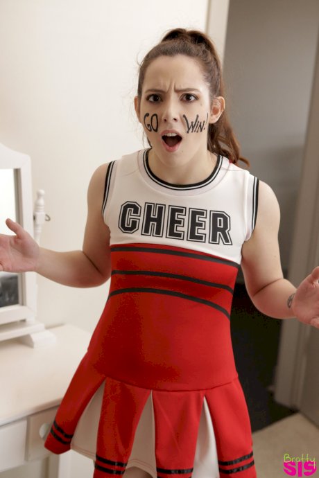 Slutty blonde cheerleader interrupts practice to fuck stepbrother for creampie
