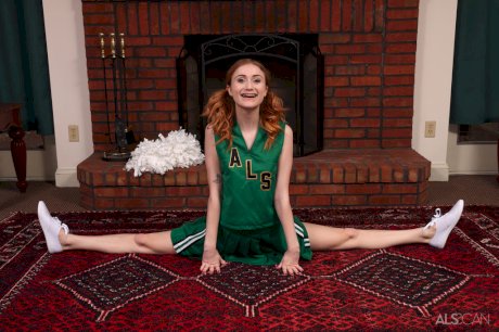 Young redheaded cheerleader Scarlet Skies gets naked for Kegel exercises