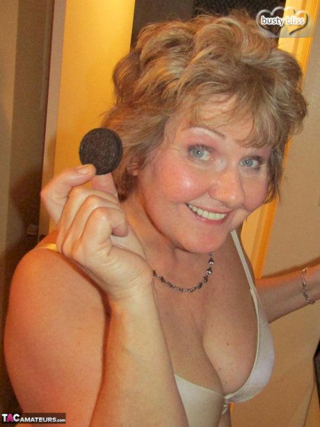 Mature woman Busty Bliss uncovers her natural boobs before pleasuring a penis