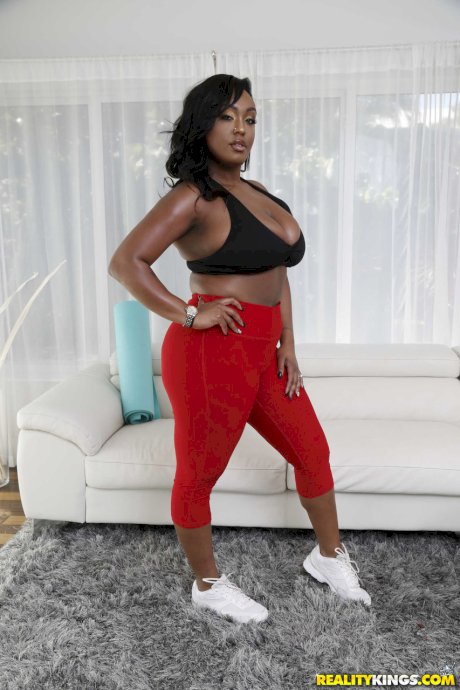 Ebony with amazing boobs Layton Benton strips and gets whited on a yoga mat