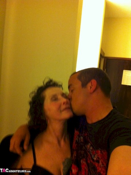 Curly haired mature woman likes sending her younger partner provocative photos
