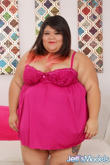 SSBBW Asian teen on knees sucking cock & showing big saggy boobs in heels