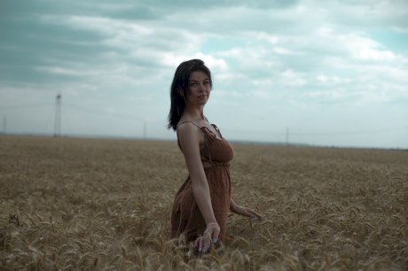 Breathtaking amateur babe Lyalya massages her big tits in a wheat field