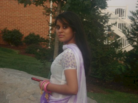 Indian female exposes her big natural tits during candid action at home