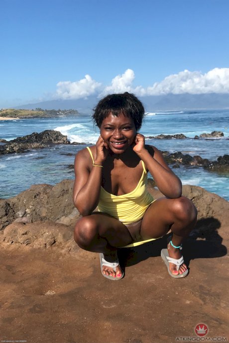 Petite ebony Noemie Bilas exposing her tits, pussy and feet in a solo