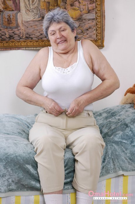 Chubby grey-haired granny Othilia toys her horny hairy pussy with a dildo
