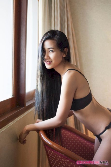 Pretty Asian babe Pop shows her creampied pussy after a hot striptease