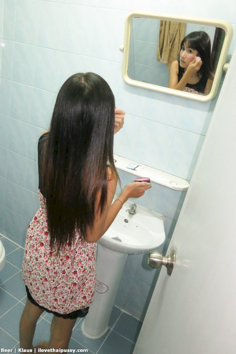 Busty Thai girl Beer gives up her shaved pussy to a sex tourist in hotel room