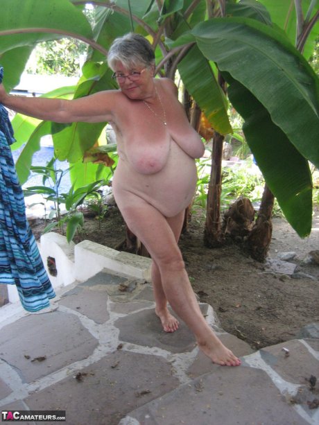 Old woman Girdle Goddess smokes before exposing her fat body on her patio