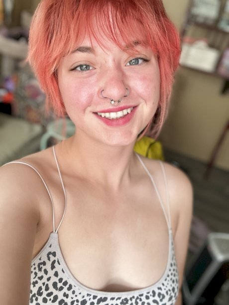 Pink-haired amateur slut Redhead Abby poses dressed up in the mirror