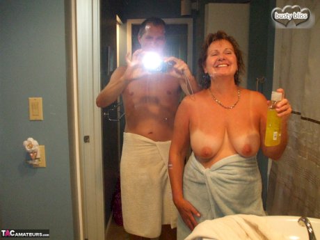 Busty older lady Busty Bliss engages in oral sex with her man friend