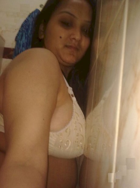 Overweight Indian student shows her bare mid-section in a brassiere