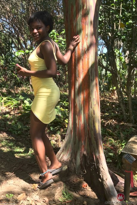 Petite ebony Noemie Bilas exposing her tits, pussy and feet in a solo