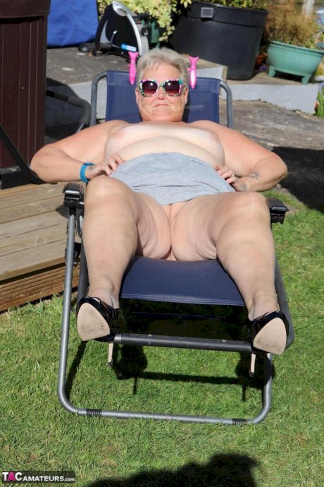 Fat nan Valgasmic Exposed shows her tits and snatch on a backyard lounge chair