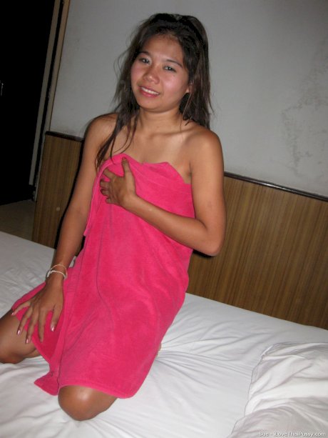 Petite Thai girl washes up her shaved pussy after bareback sex with a tourist