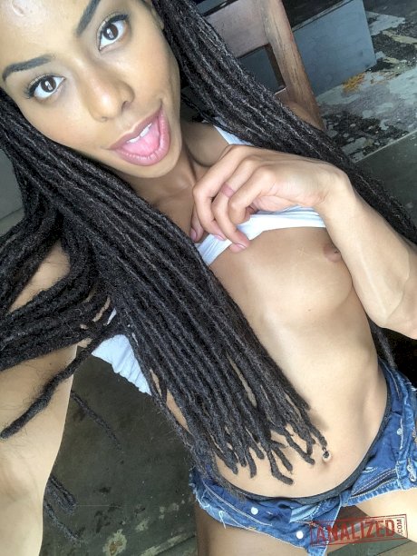 Ebony with dreads Kira Noir unveils her tiny tits and sweet ass in a solo