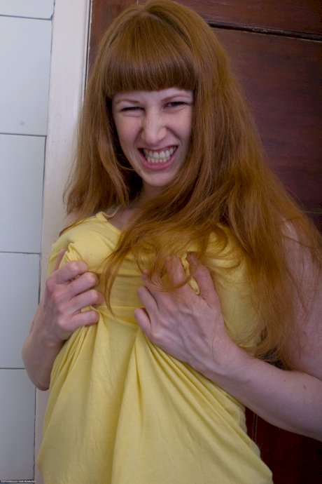Ginger Chloe B unveils her big tits & ass before rubbing her pierced muff