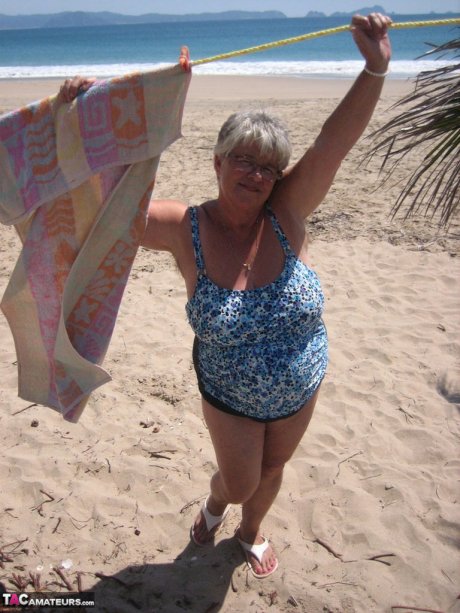 Fat granny Girdle Goddess takes off swimwear to pose nude at the ebach