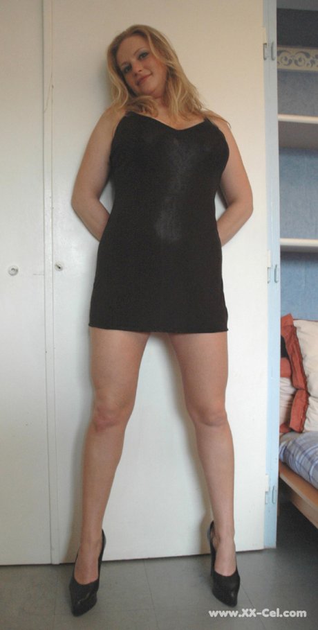 Beautiful amateur MILF in a black dress Zdenka K exposes her sexy legs and ass
