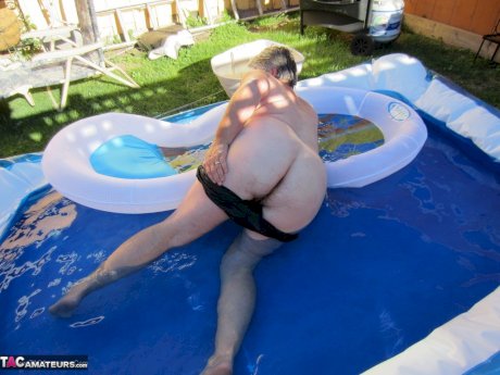 Fatty mature granny Girdle Goddess peels to enjoy wading pool skinny dip