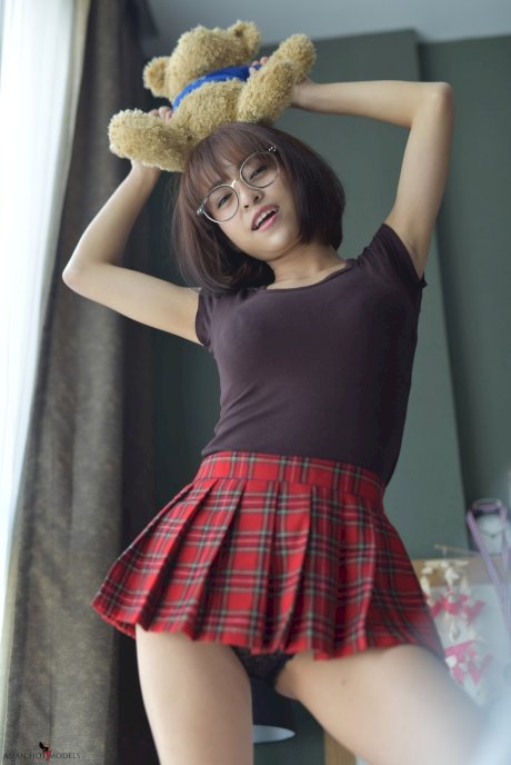 Pretty Asian teen flaunts her hot ass wearing a miniskirt and panties
