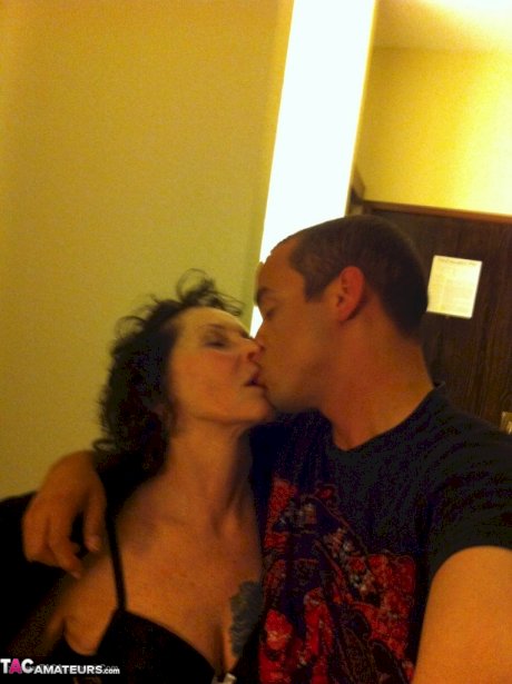 Curly haired mature woman likes sending her younger partner provocative photos