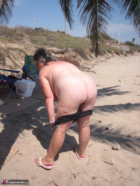 Fat granny Girdle Goddess takes off swimwear to pose nude at the ebach