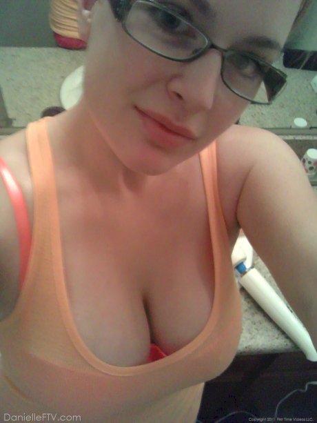 Blonde amateur Danielle takes sexy selfies around her home in a SFW manner