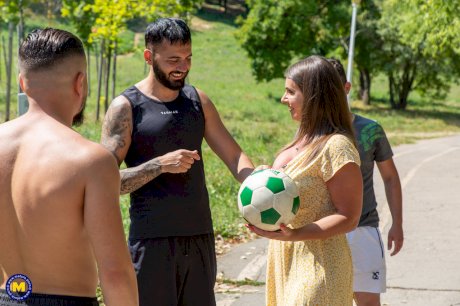 Busty soccer mom does a double penetration during a gangbang