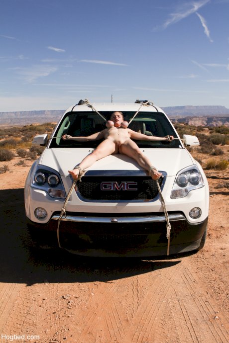 Naked Cherry Torn gets bound to a car & pulled by her big tits in the desert
