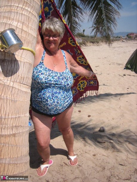 Fat granny Girdle Goddess takes off swimwear to pose nude at the ebach