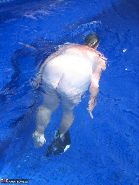 Fat nan Girdle Goddess goes for a skinny dip in a backyard pool