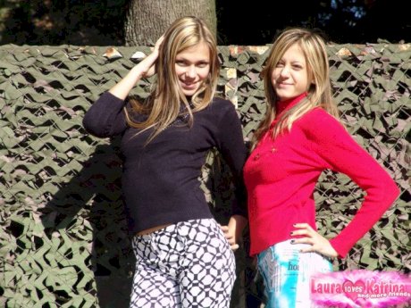 Young hot blonde lesbian teens having fun flashing their small tit in the sun