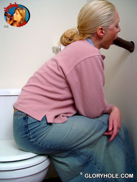 Blonde girl Jamie sits on the toilet and blows a black gloryhole dong