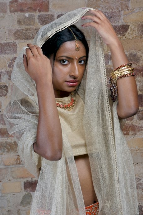 Indian model with tattoos exposes her firm tits in traditional clothing