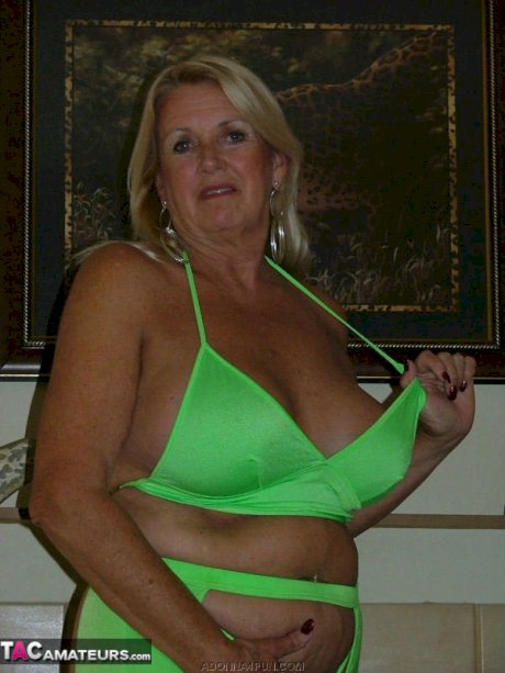 Chubby mature blonde Adonna dildo fucks her pierced pussy during solo action