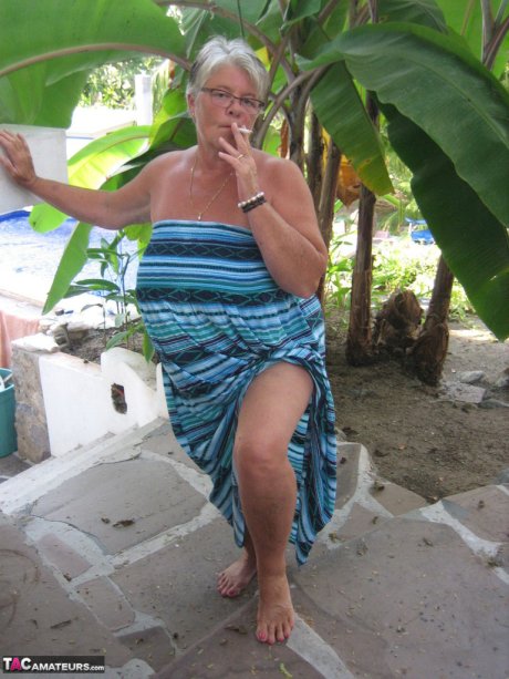 Old woman Girdle Goddess smokes before exposing her fat body on her patio