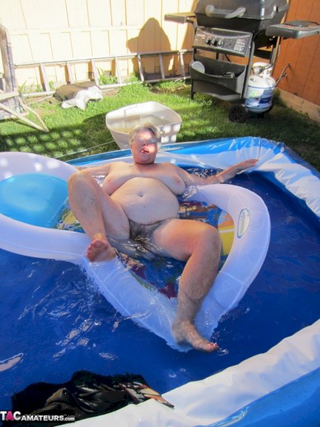 Fatty mature granny Girdle Goddess peels to enjoy wading pool skinny dip