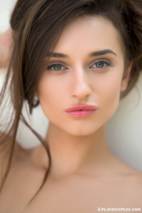 Solo girl Gloria Sol shows off her pleasing face while posing nude for Playboy