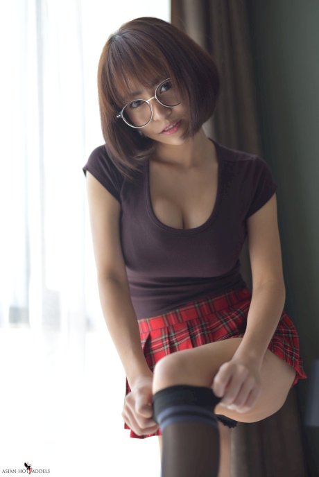 Pretty Asian teen flaunts her hot ass wearing a miniskirt and panties
