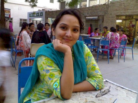 Overweight Indian student shows her bare mid-section in a brassiere