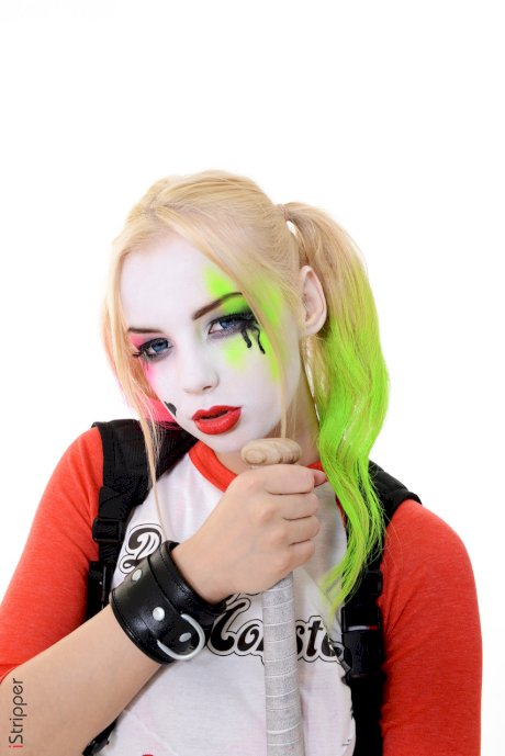 Solo girl with a painted face strips naked after putting down her baseball bat