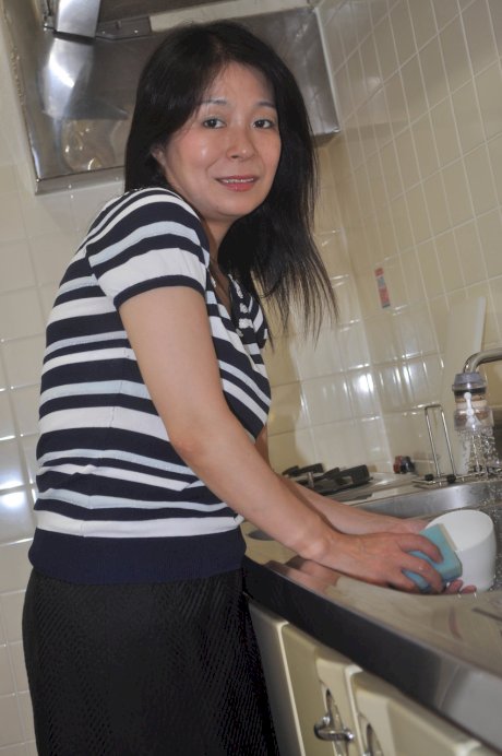 Petite Japanese granny Akiko Oda strips and shows her bushy wet beaver