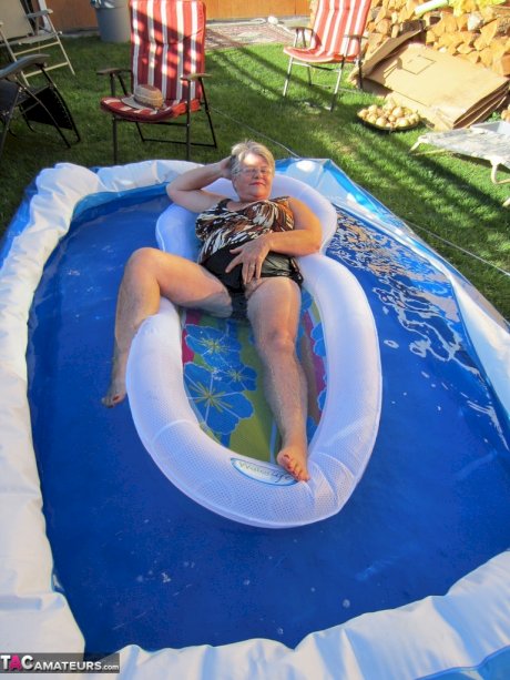 Fatty mature granny Girdle Goddess peels to enjoy wading pool skinny dip