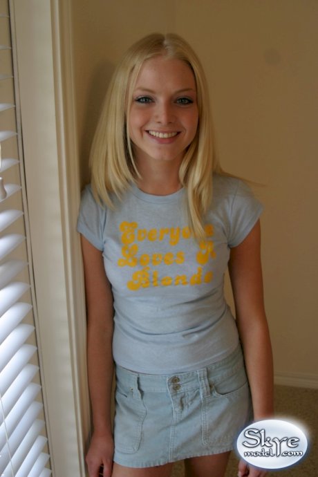 Blonde amateur Skye Model models by herself in a short skirt
