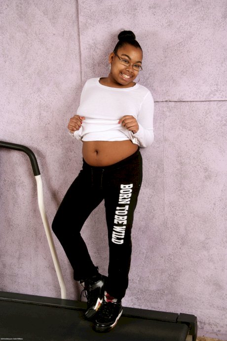 Cute nerdy ebony Monica Jimenez exposes her chubby body and hairy pussy